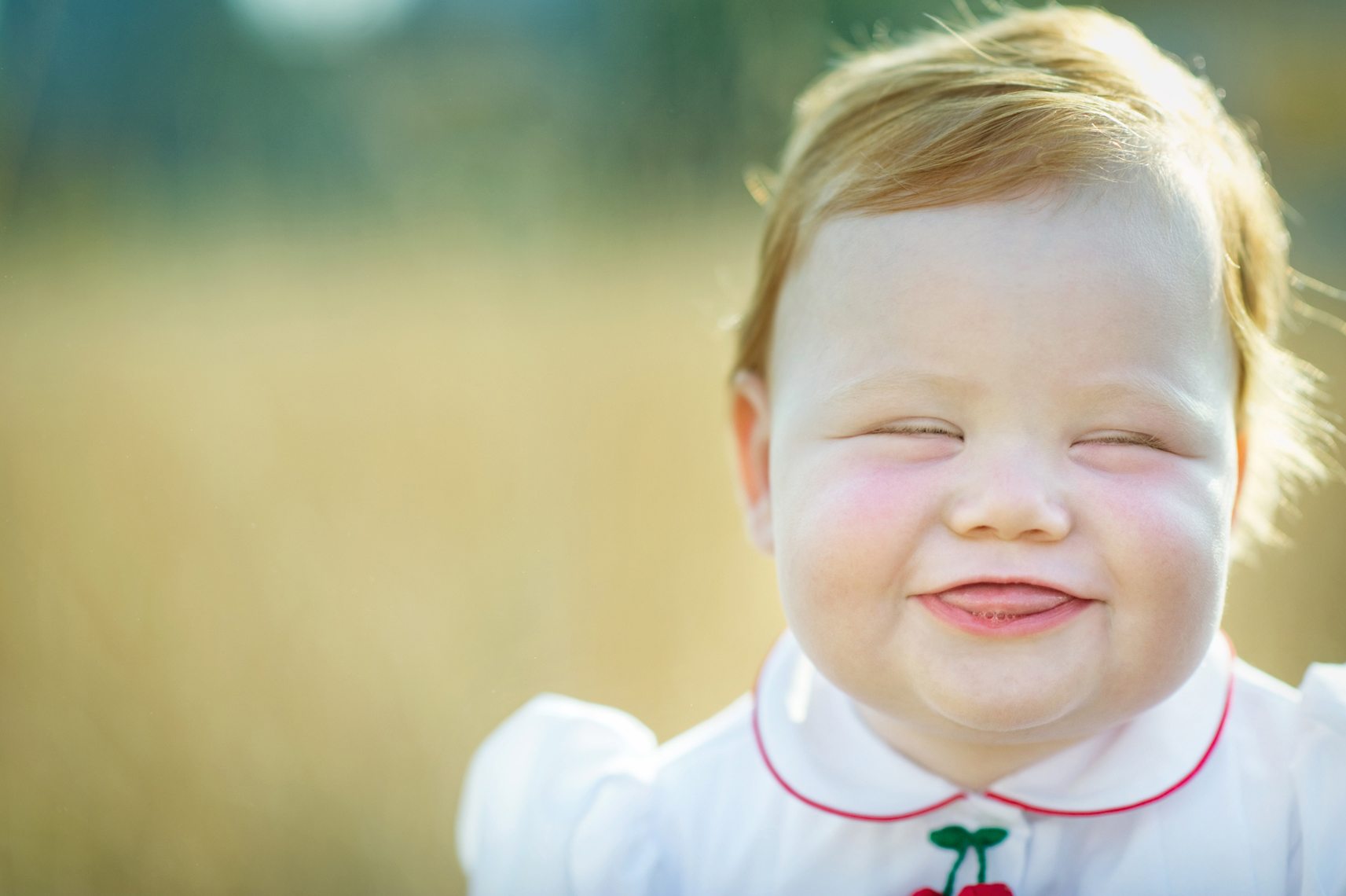 laughing baby with red hair