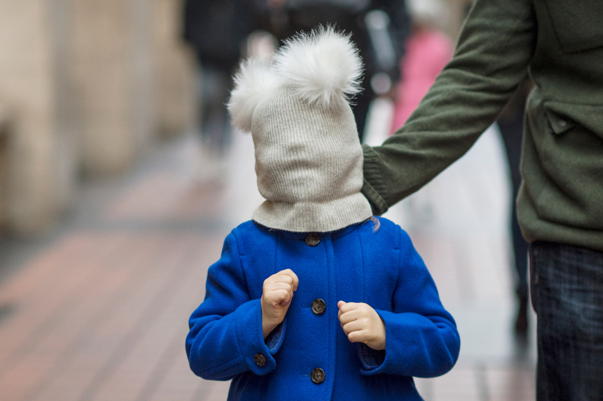 girl with winter hat and pom pom